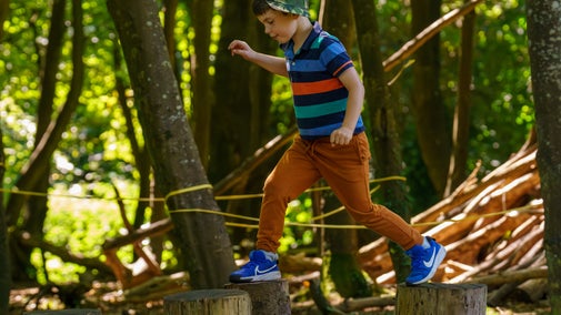 Boy plays at Summer of Play Mount Stewart